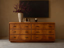 Front view of the brown Palma Six-Drawer Dresser, showcasing distinctive cerajeira veneer graining and aged bronze hardware.